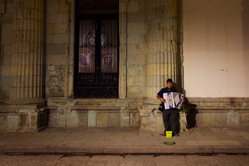 Blind accordion player surviving in his world...