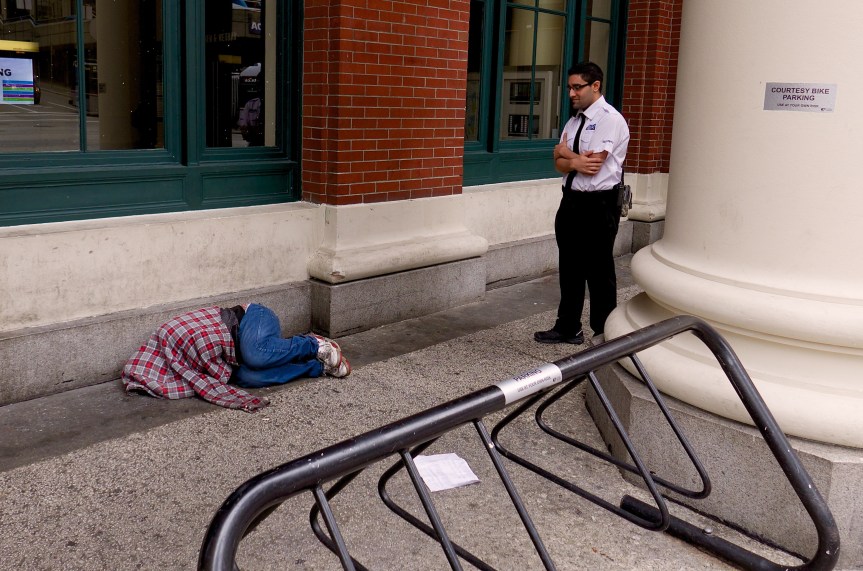 That's courtesy bike parking, not courtesy sleeping! He was quickly moved along....